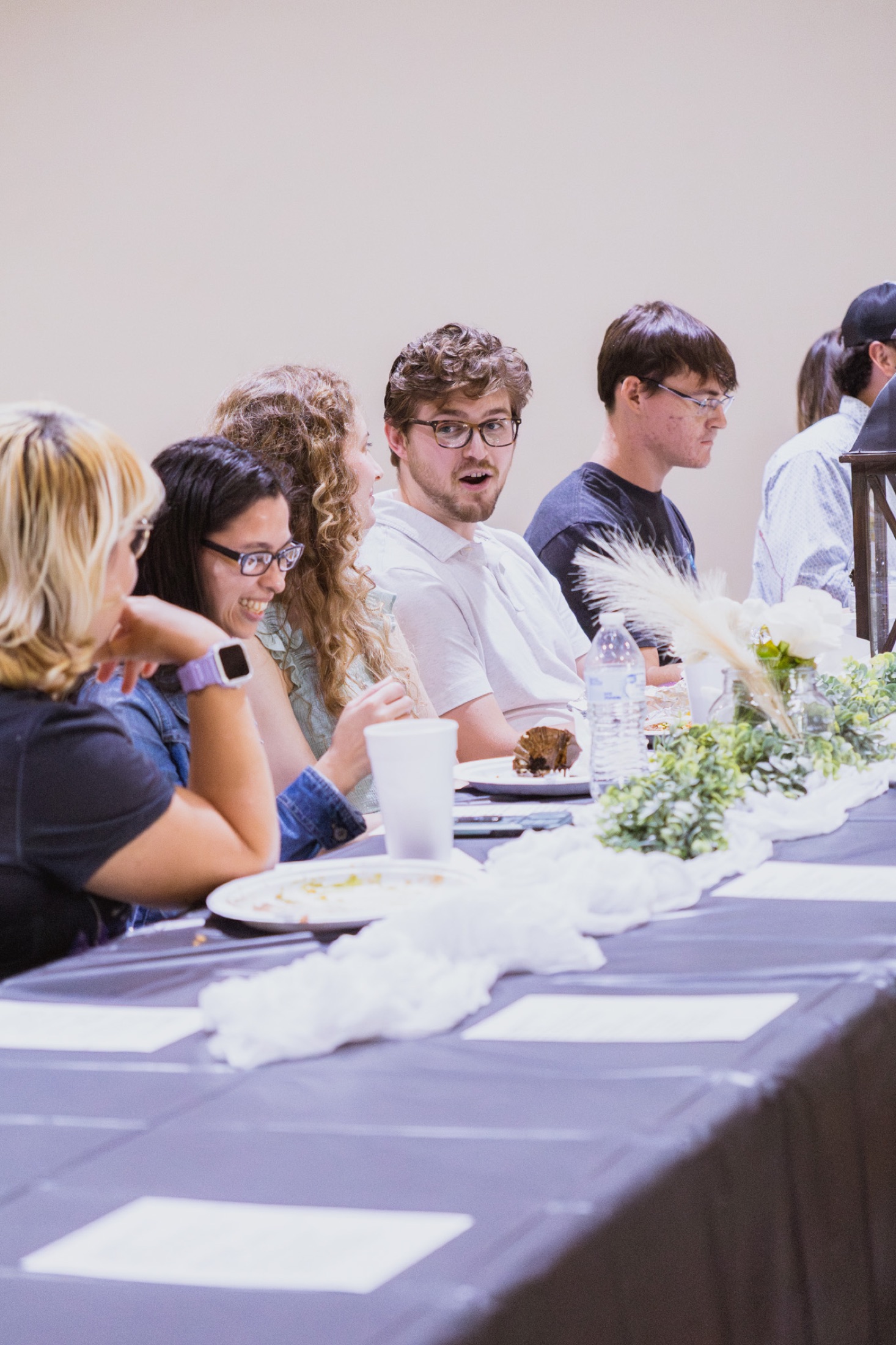 Young adults sharing a meal and fellowship at Gospel Light